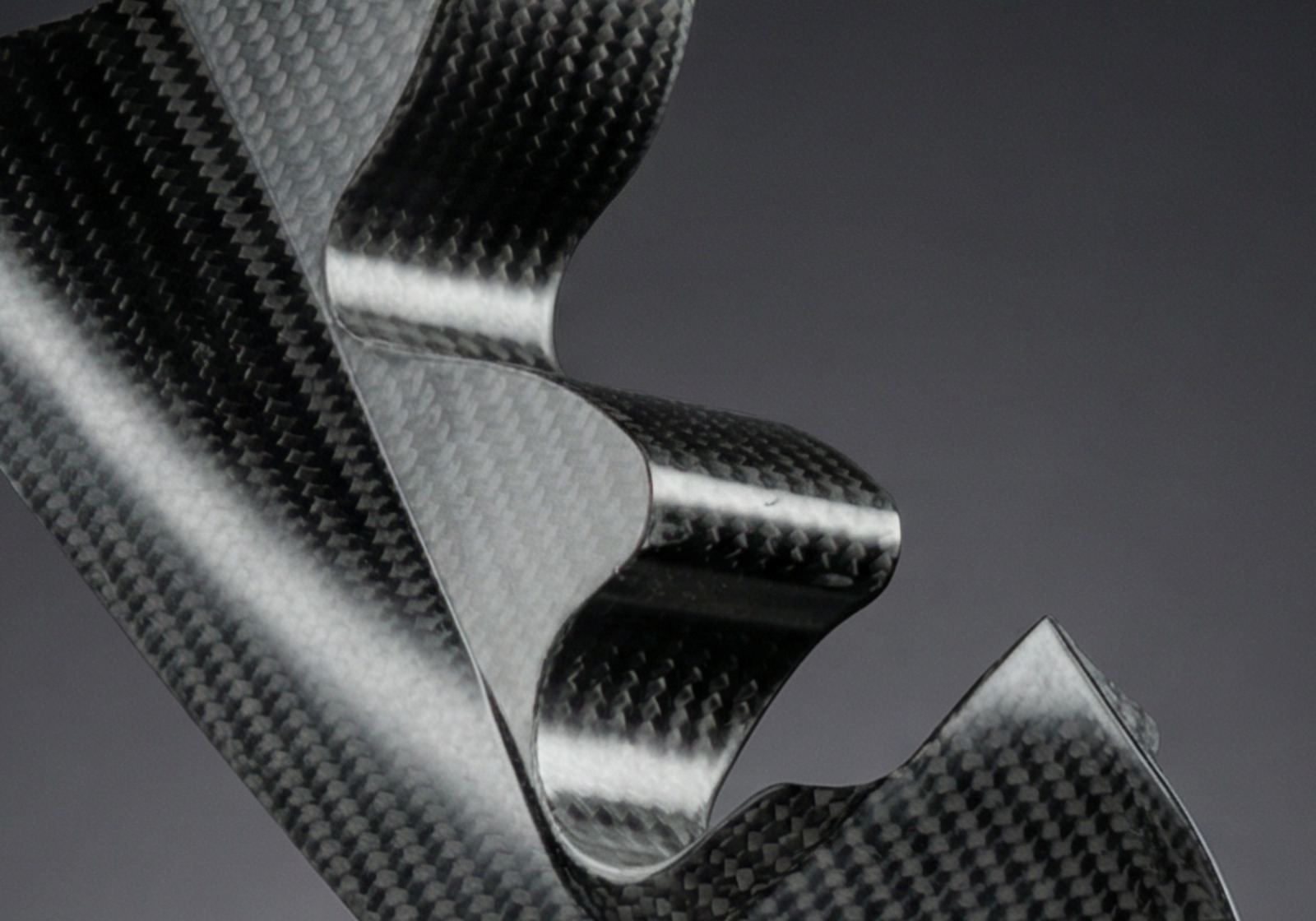 Ex-Core carbon fibre composite part on black background